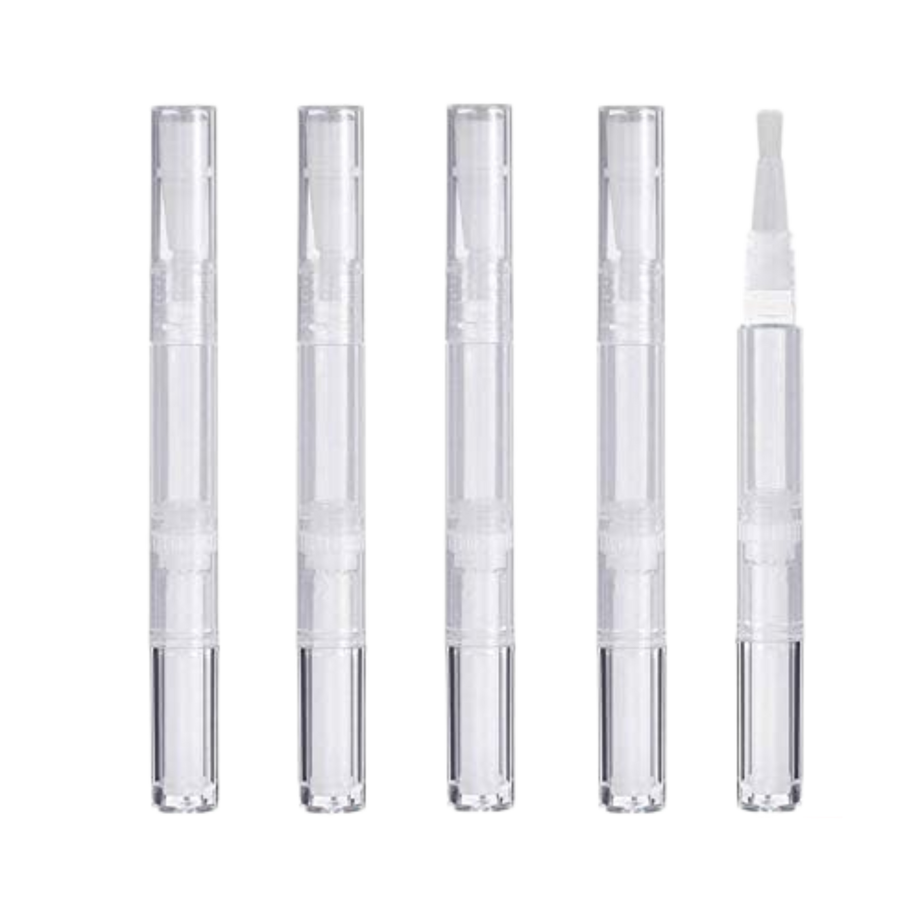 Set of five clear cosmetic applicators on a white background