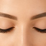 Freshly cleansed eyelash extensions with a soft, fluffy appearance in natural daylight.