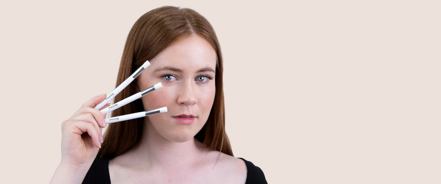 women holding three lash cleansing brushes up to her face | Prolong Lash