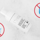 Germs being crossed out by a red cross surrounding prolong lash cleanser | Prolong Lash