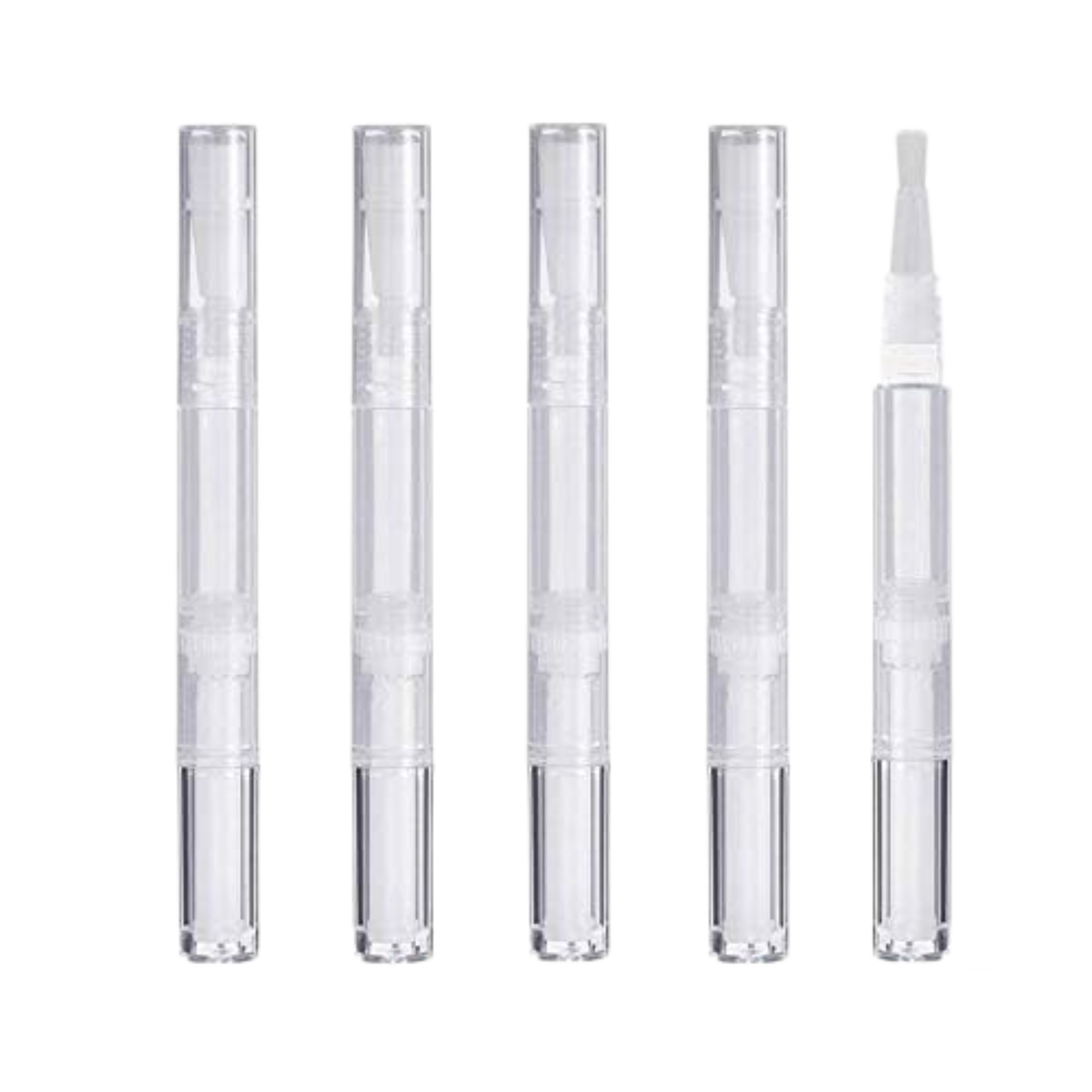 Set of five clear cosmetic applicators on a white background