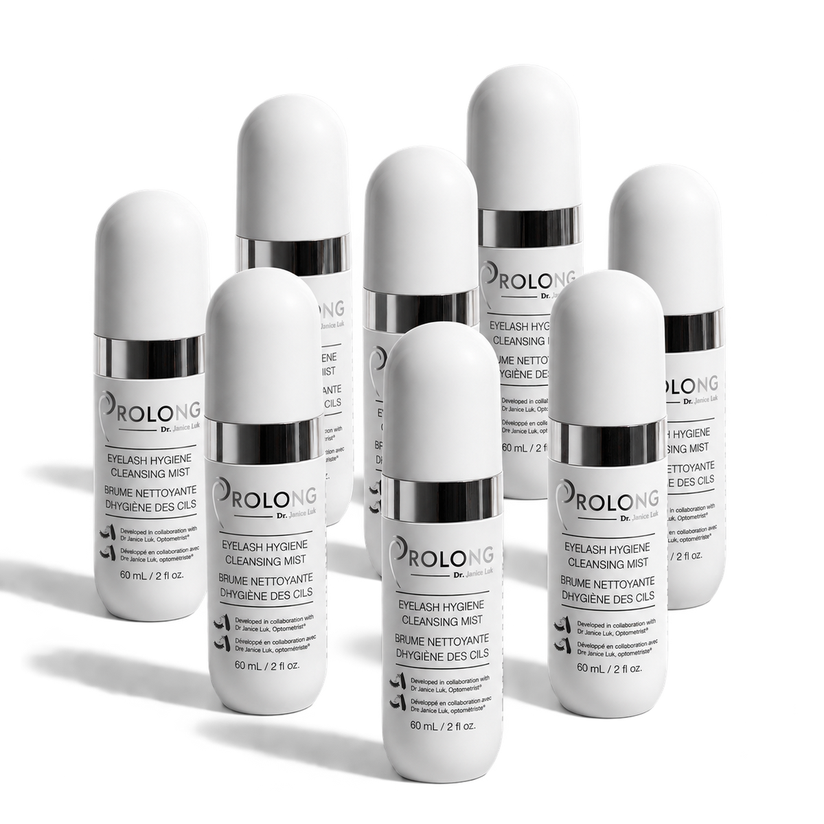 A group of white cylindrical bottles of Prolong Eyelash Hygiene Cleansing Mist with silver caps, arranged on a clean white background.