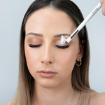 Girl cleaning eyelash extensions